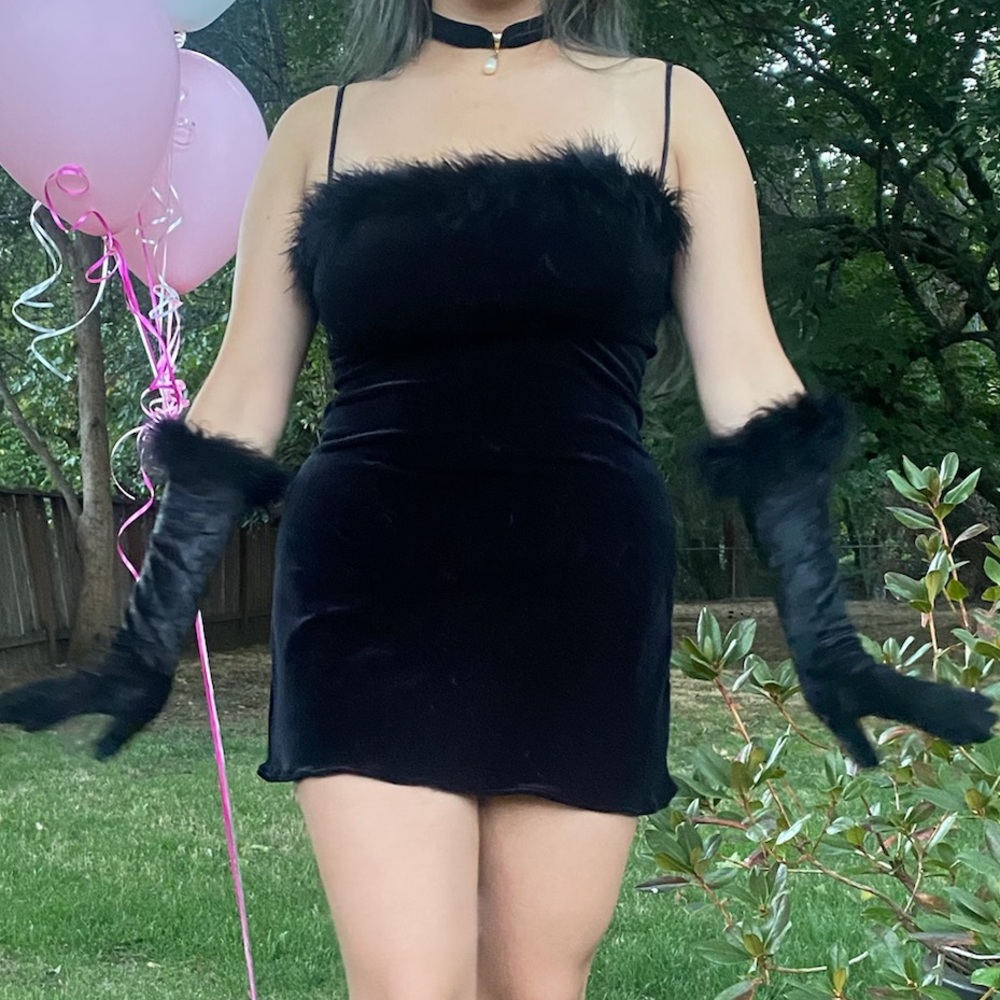 black mini dress with feather trim and matching gloves